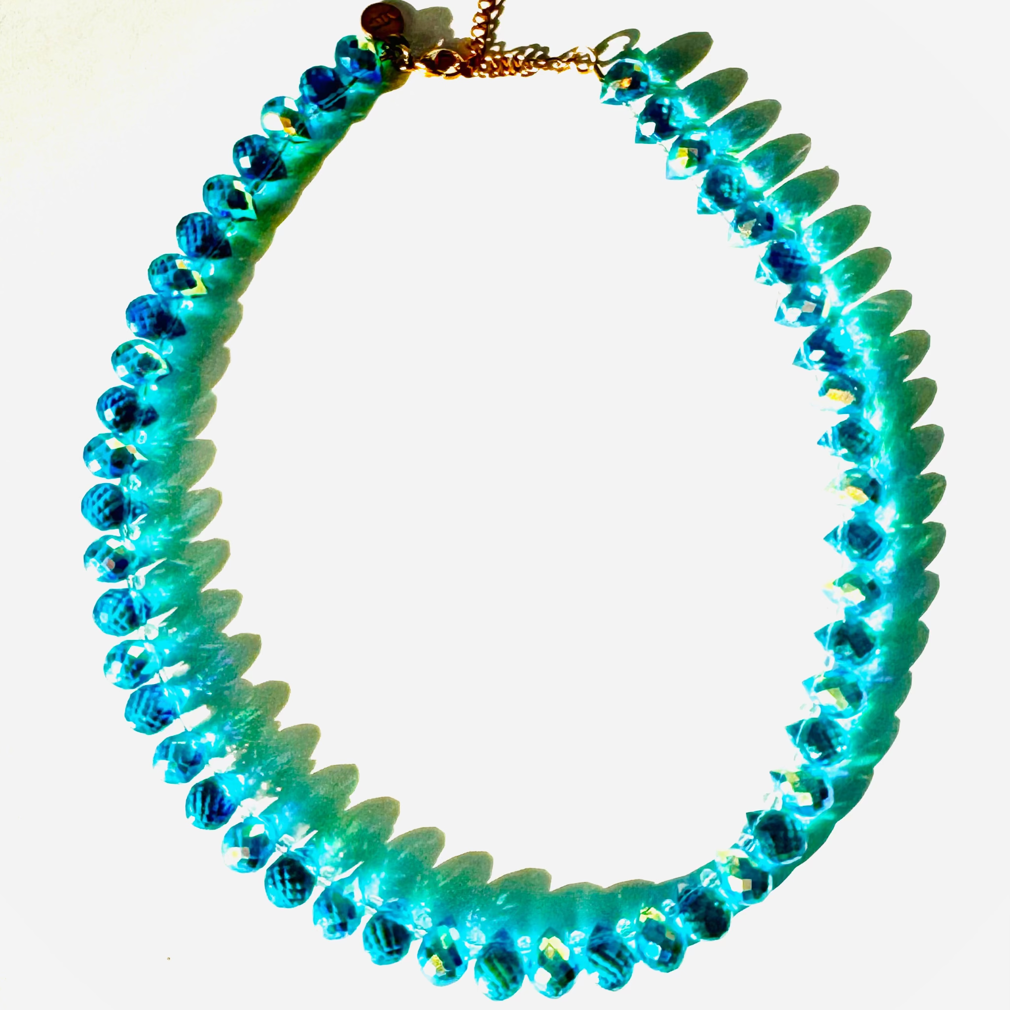 Turquoise beaded necklace on a white background