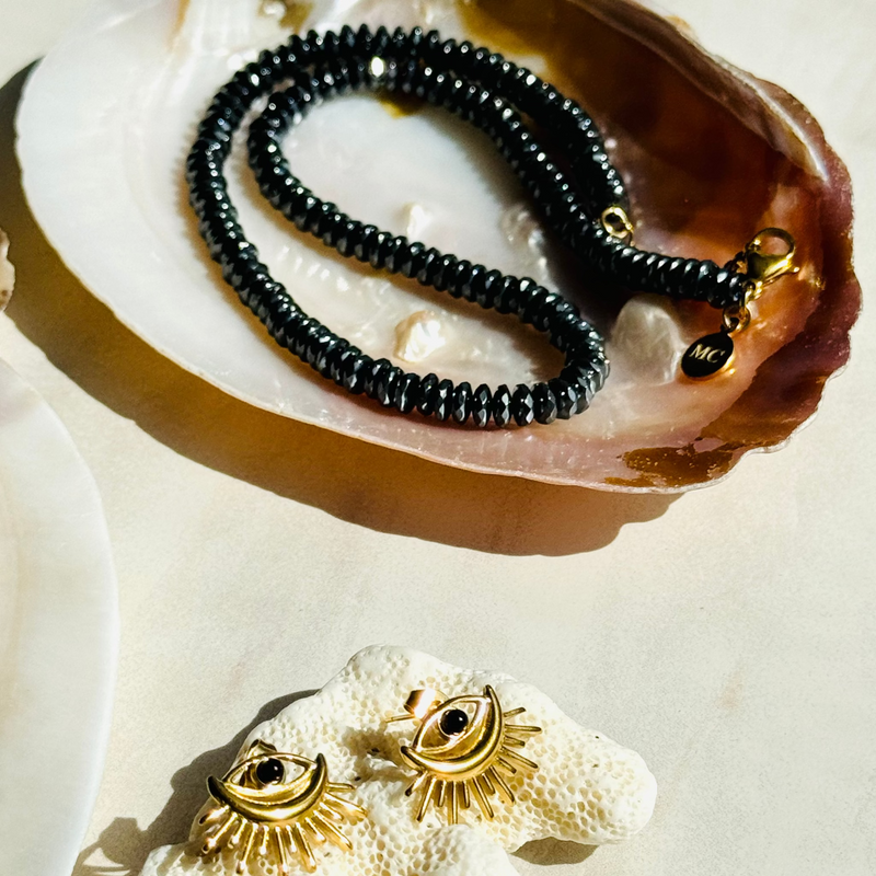 Stability Hematite Necklace and Evil Eye Stud Easrrings on shell 