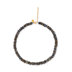 A beaded labradorite statement necklace with a gold plated sterling silver closure, displayed on a loop.