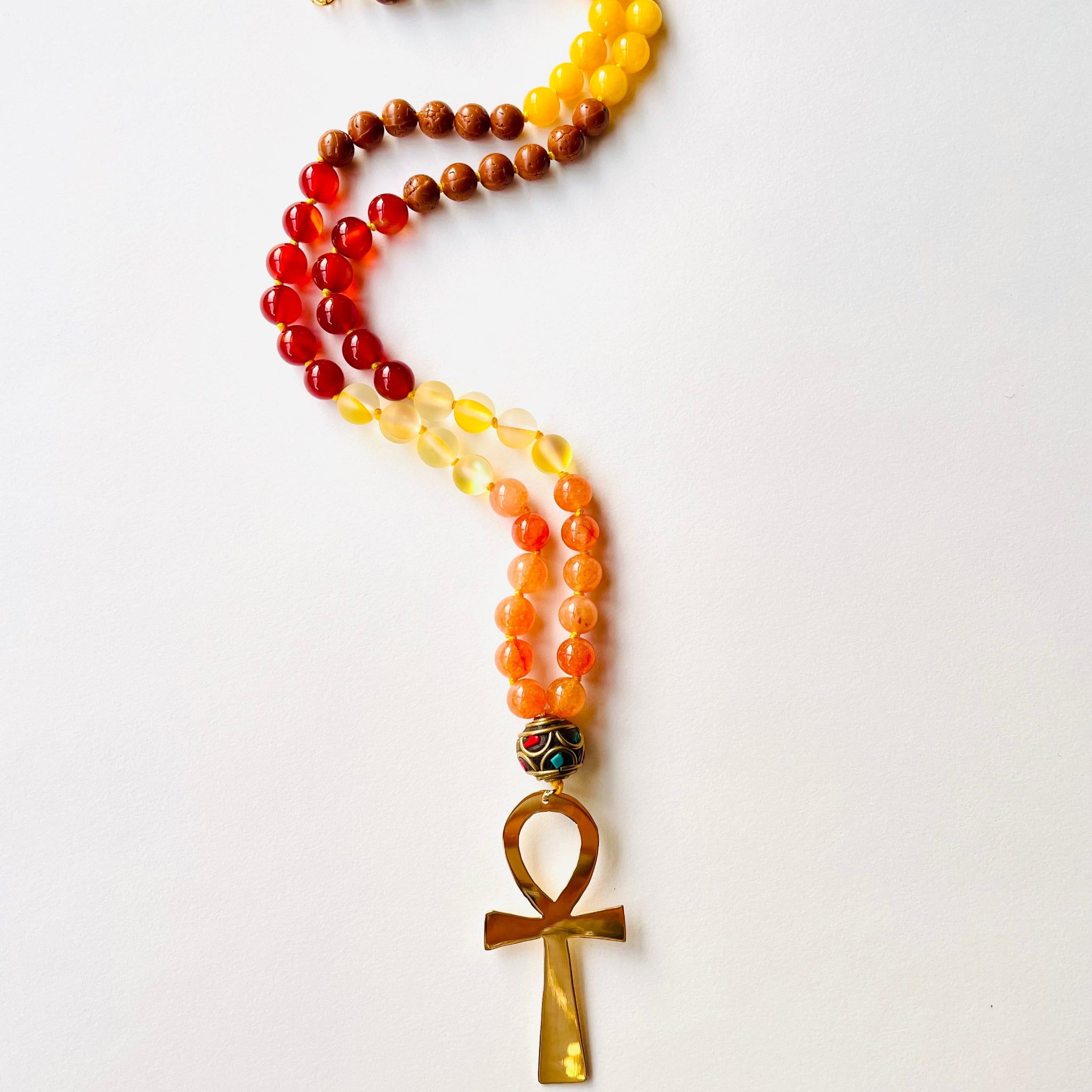 red yellow and orange beaded necklace with ankh symbol pendant