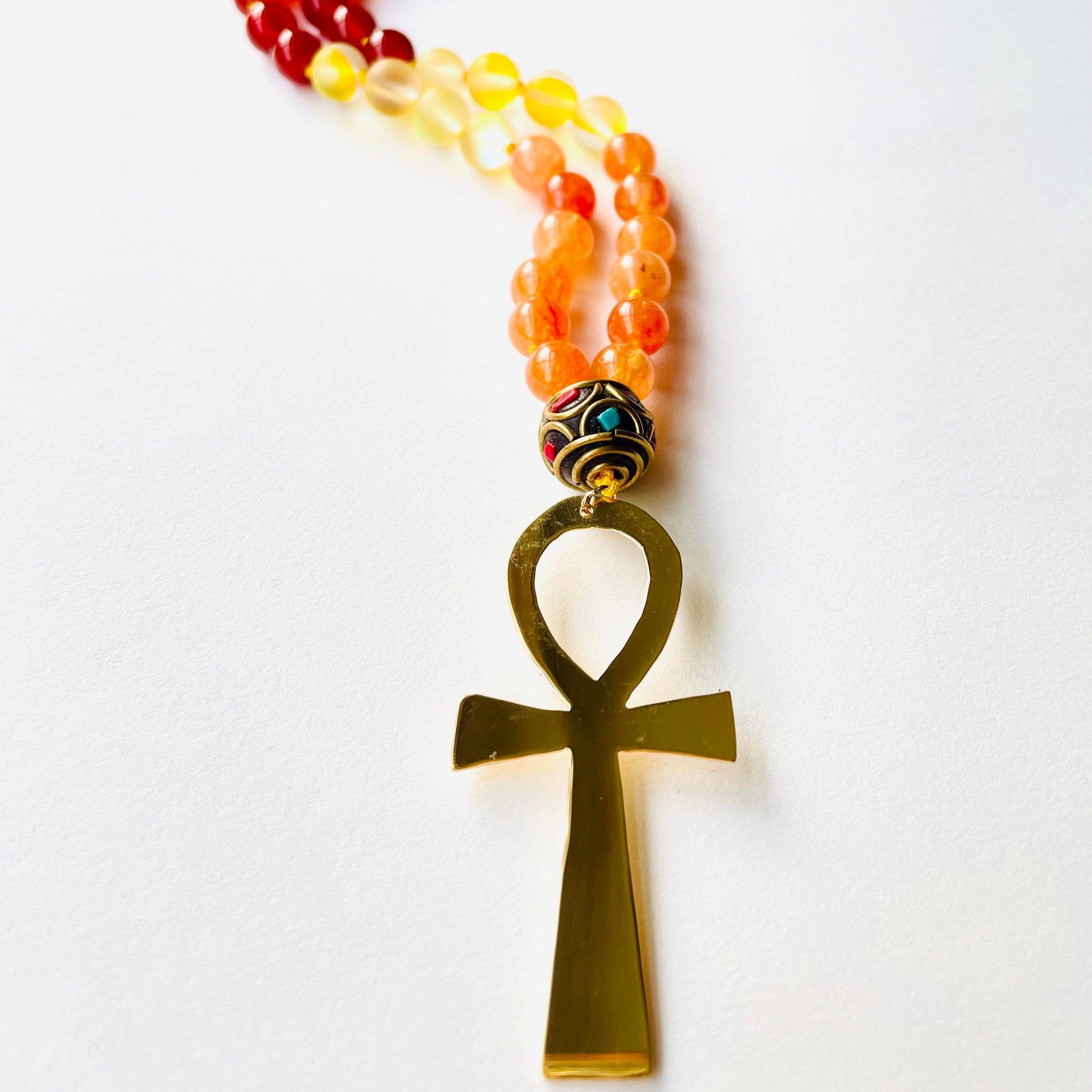 Ankh pendant with orange yellow and red gemstone beads