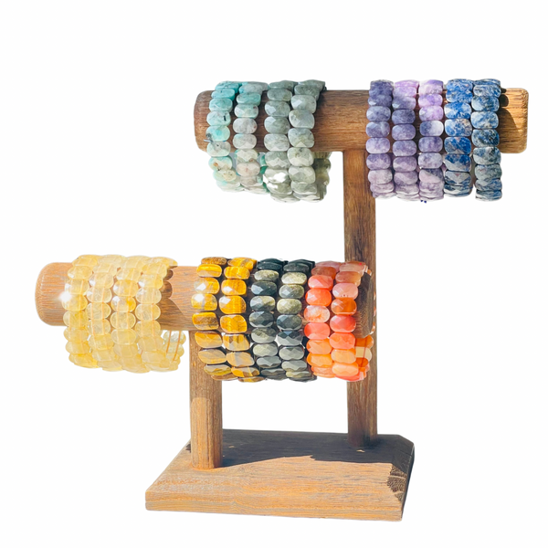 Obsidian Amazonite Carnelian Citrine Lepidolite gemstone bracelets hanging on wood display
