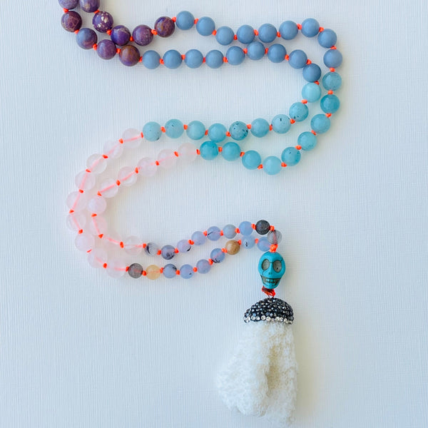 beaded blue purple and white gemstones with coral pendant