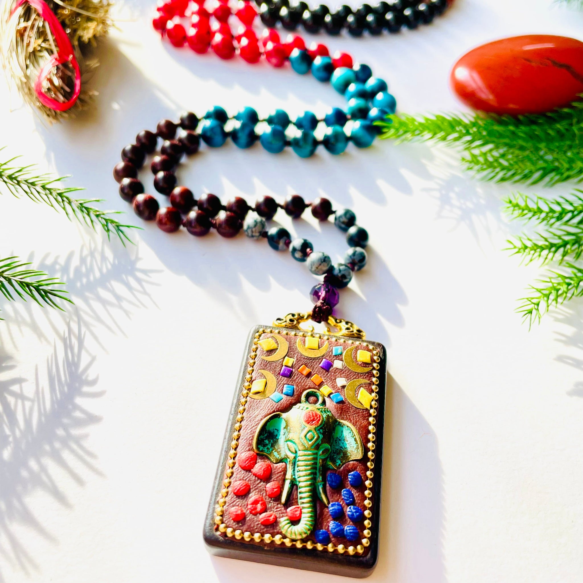 Ground to Grow mala closeup image showing elephant pendant