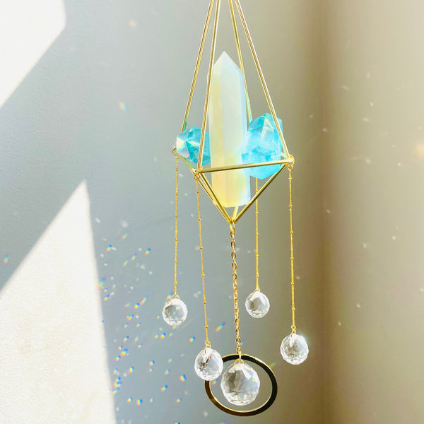 Opal Tower Suncatcher with prisms making rainbow reflections