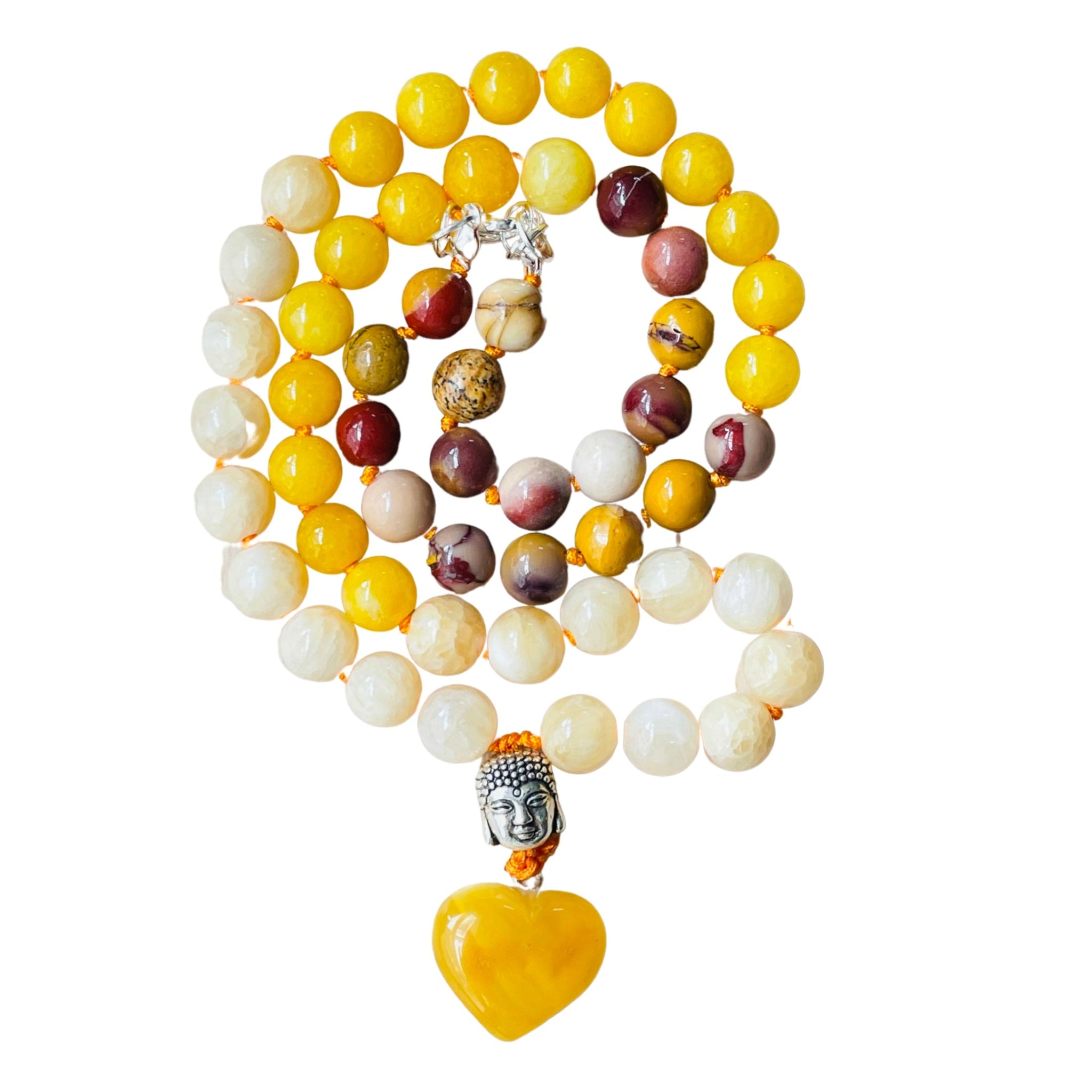 A colorful half mala necklace with a heart-shaped amber pendant, featuring yellow, red, and white beads.