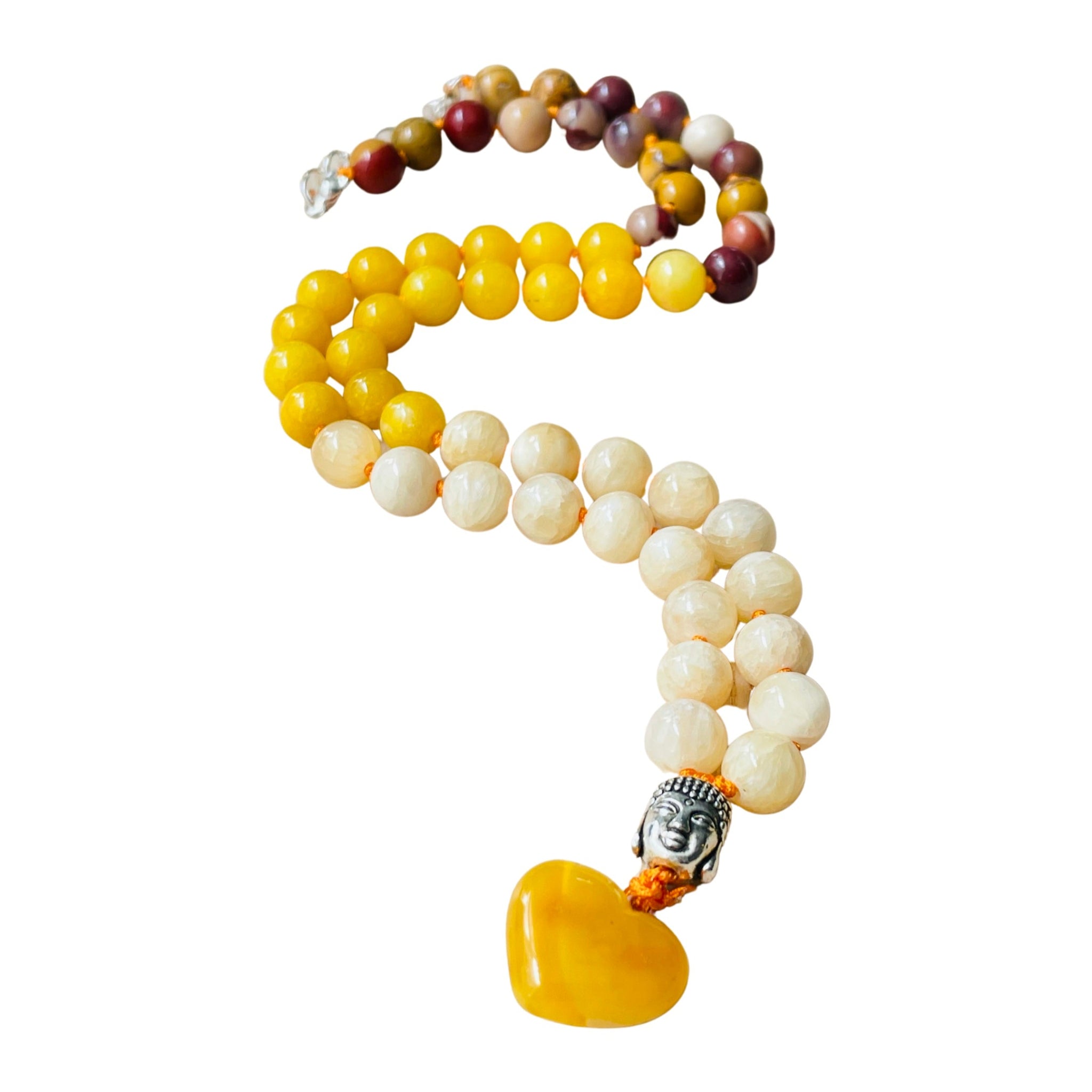 Beaded necklace with yellow, white, and brown beads and a Buddha pendant on a white background