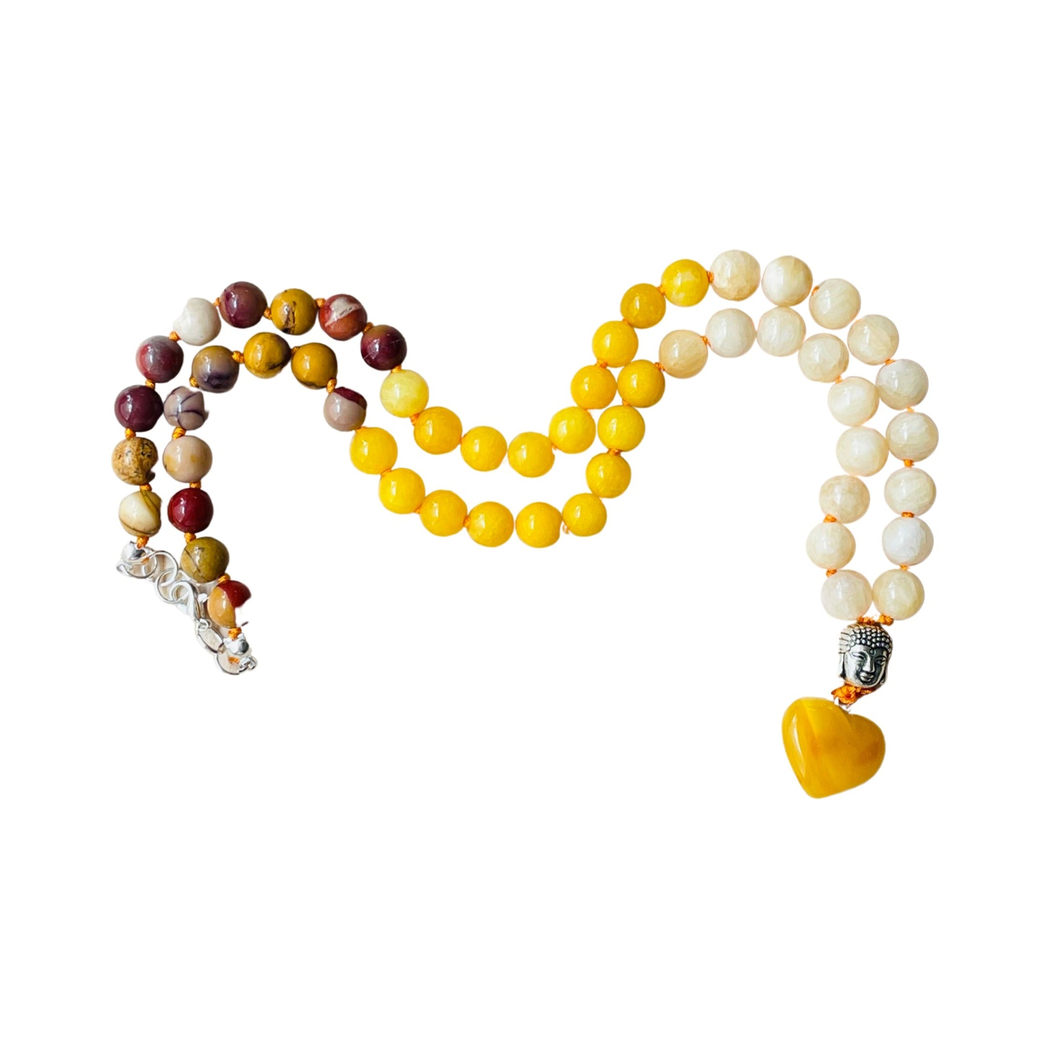 Three beaded necklaces arranged in a heart shape on a white background