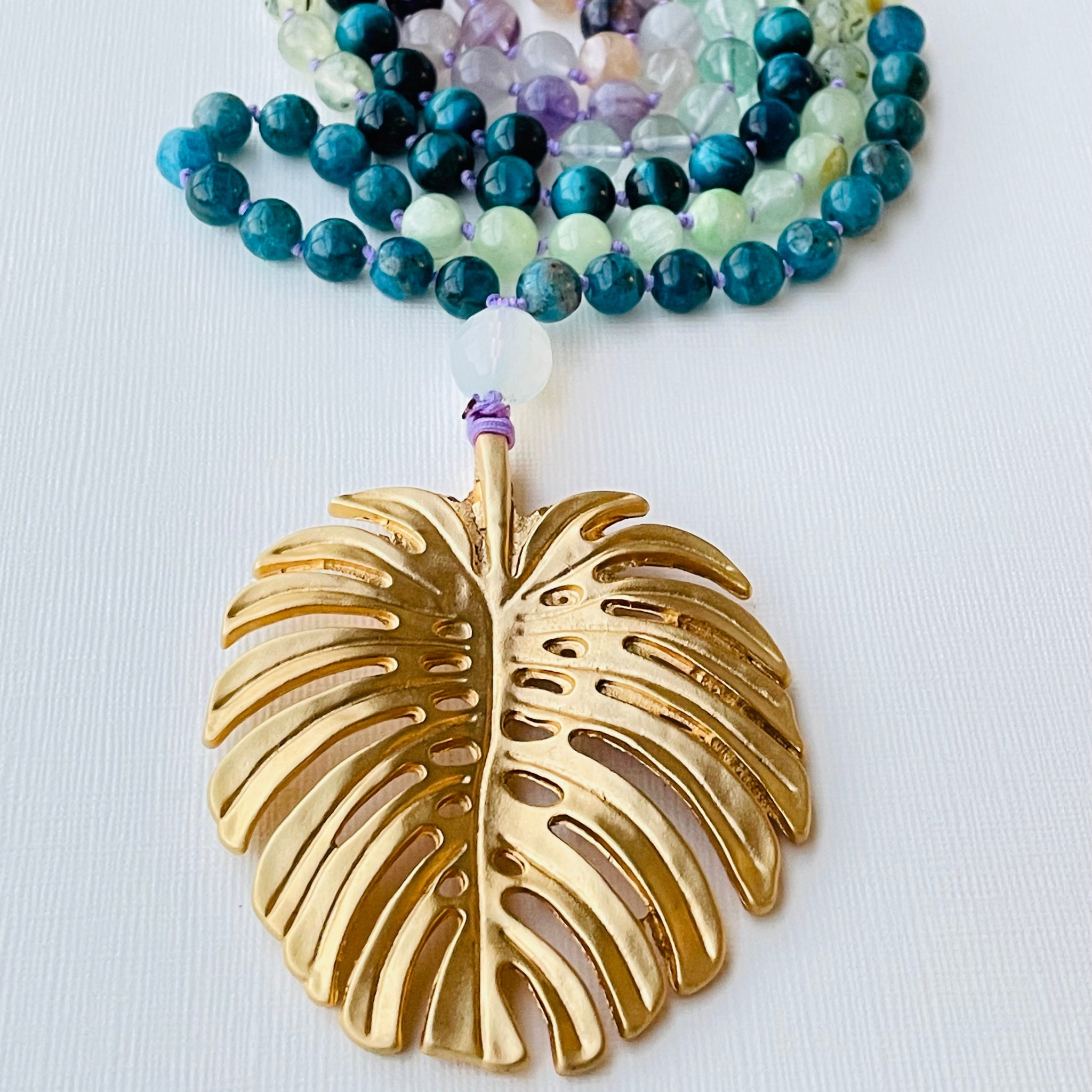 green gemstone necklace with Monstera leaf pendant