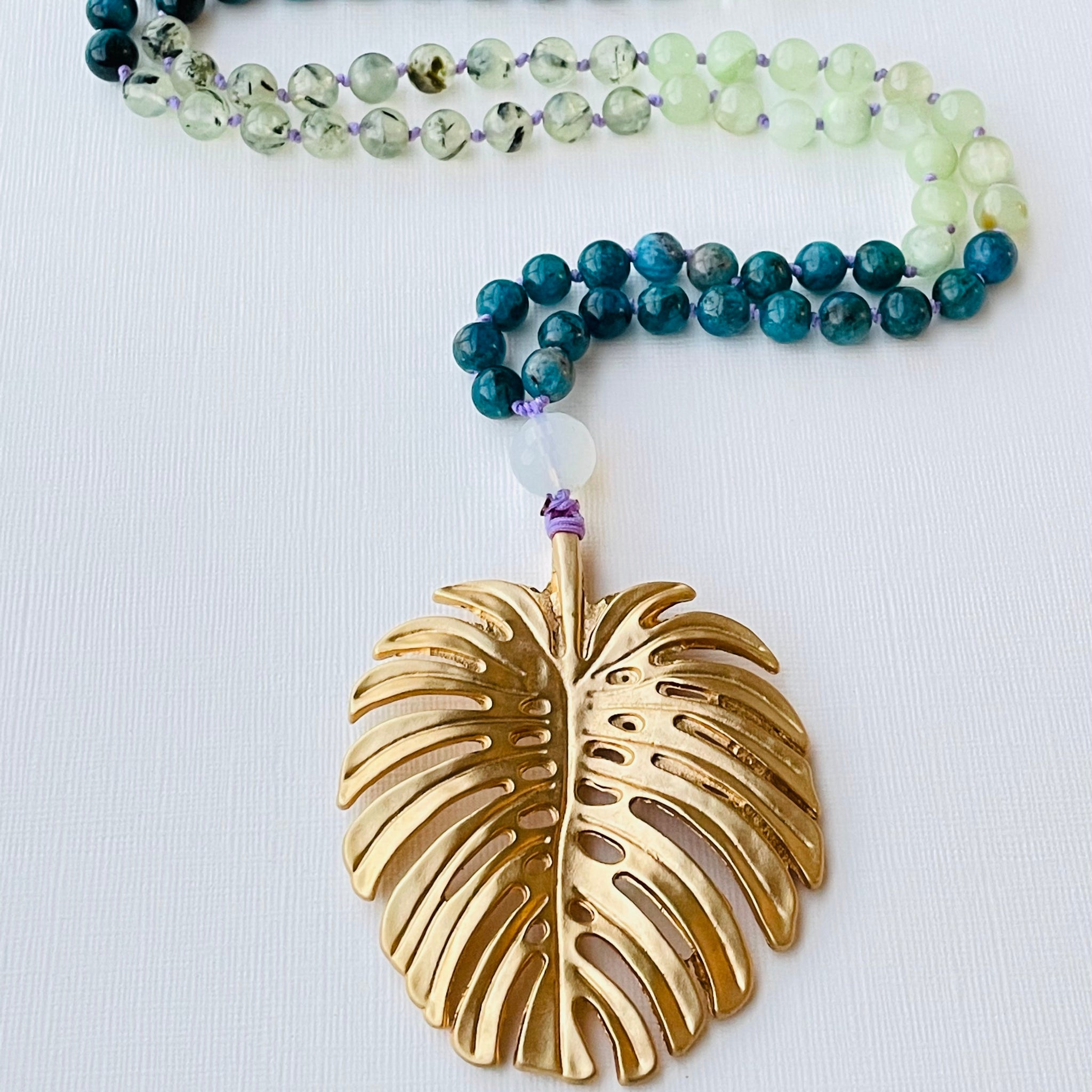 Monstera leaf and beaded blue green gemstones