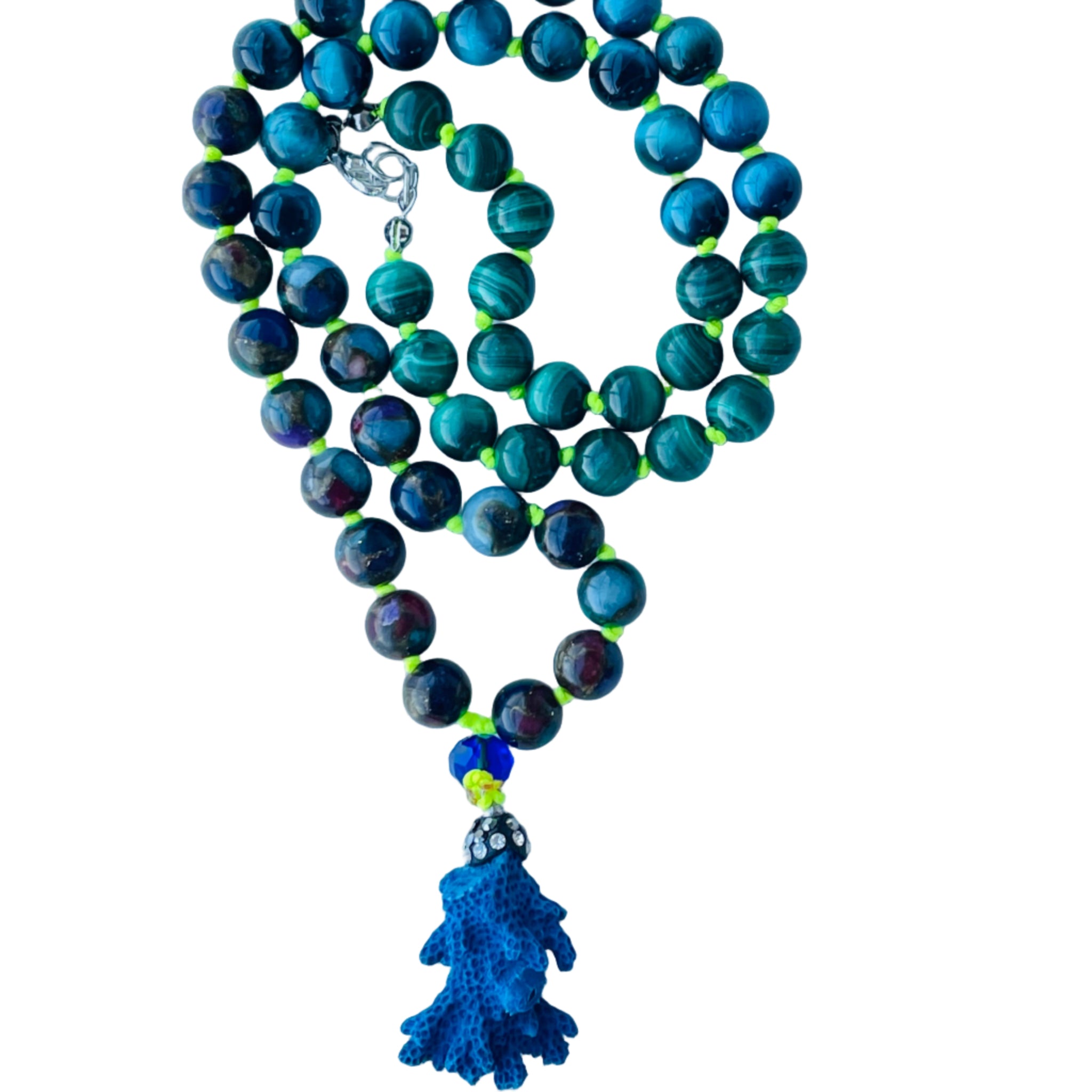Beaded blue and green gemstones on yellow strand with blue coral pendant